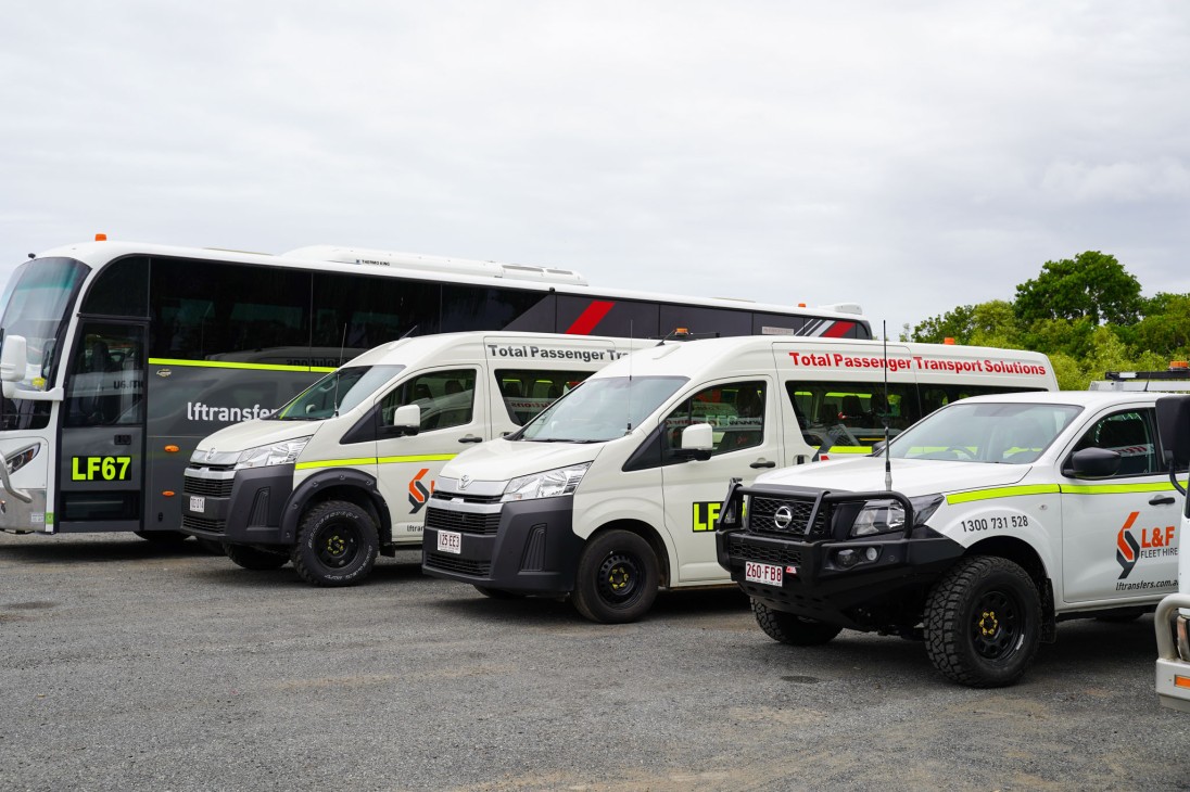 A range of our hire vehicles at Yeppoon depot. Luxury coach, HiAce minibus 4WD, HiAce passenger van 2WD, mine spec 4WD ute.